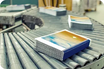 Freshly printed books on a press